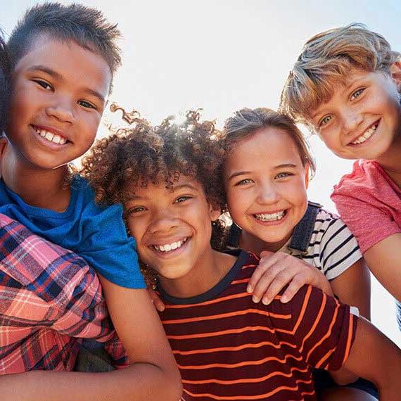 Diverse group of young students smiling at camera - Connections Academy