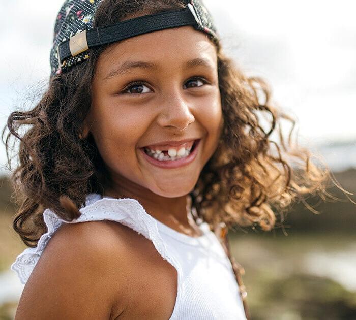 A young girl smiling